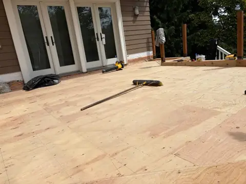 Plywood deck surface before waterproof membrane installation