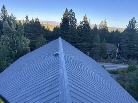 Gray metal roof after roof painting